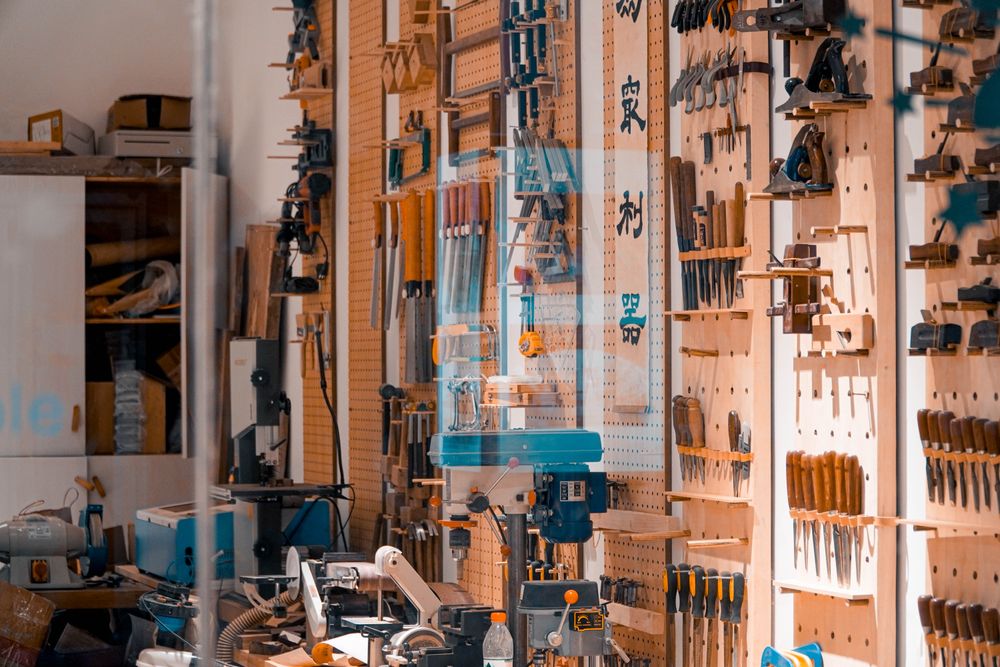 Hand tools hung in order on a workshop wall