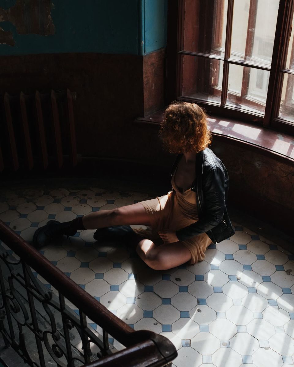 Window light, sister on the stairs