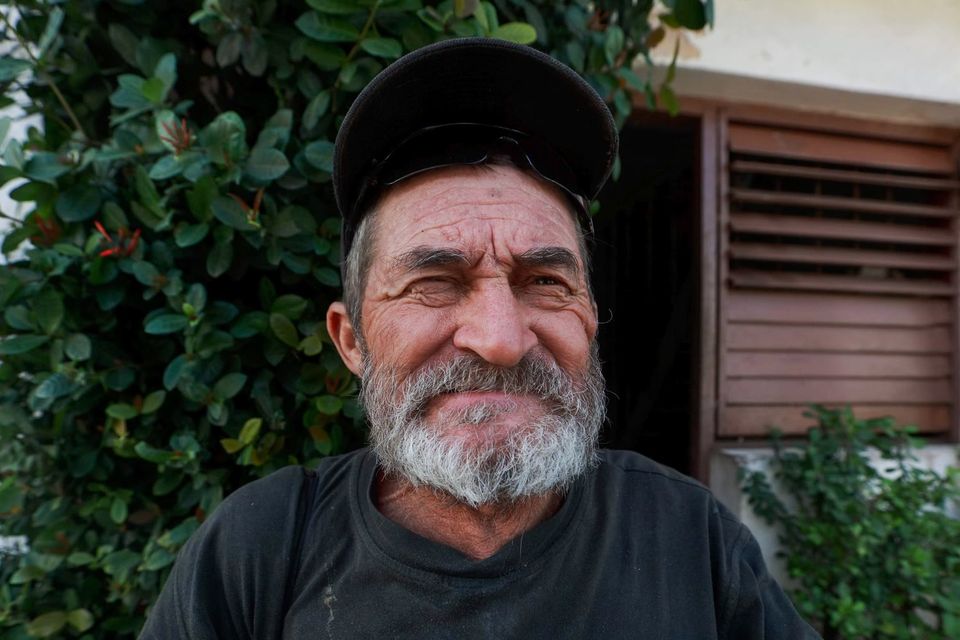 Grandfather in garden shade